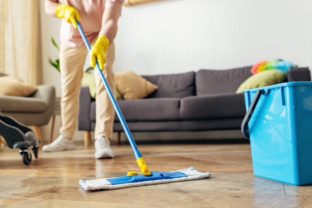 Man,In,Homewear,Deep-cleaning,Floor,With,A,Mop.