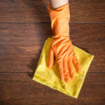 Close,Up,Of,Hand,Cleaning,The,Wooden,Parquet